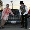 Posing by the Haunts Hearse for their "LAST RIDE," the Mayor and one of the crazies of HAUNTSBURG share a moment.  (Earl Huddleston Photo)